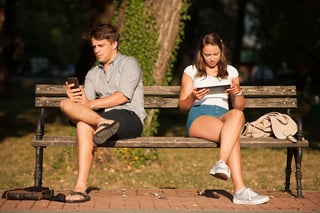 bigstock-Young-Couple-Distracted-With-C-116961497.jpg