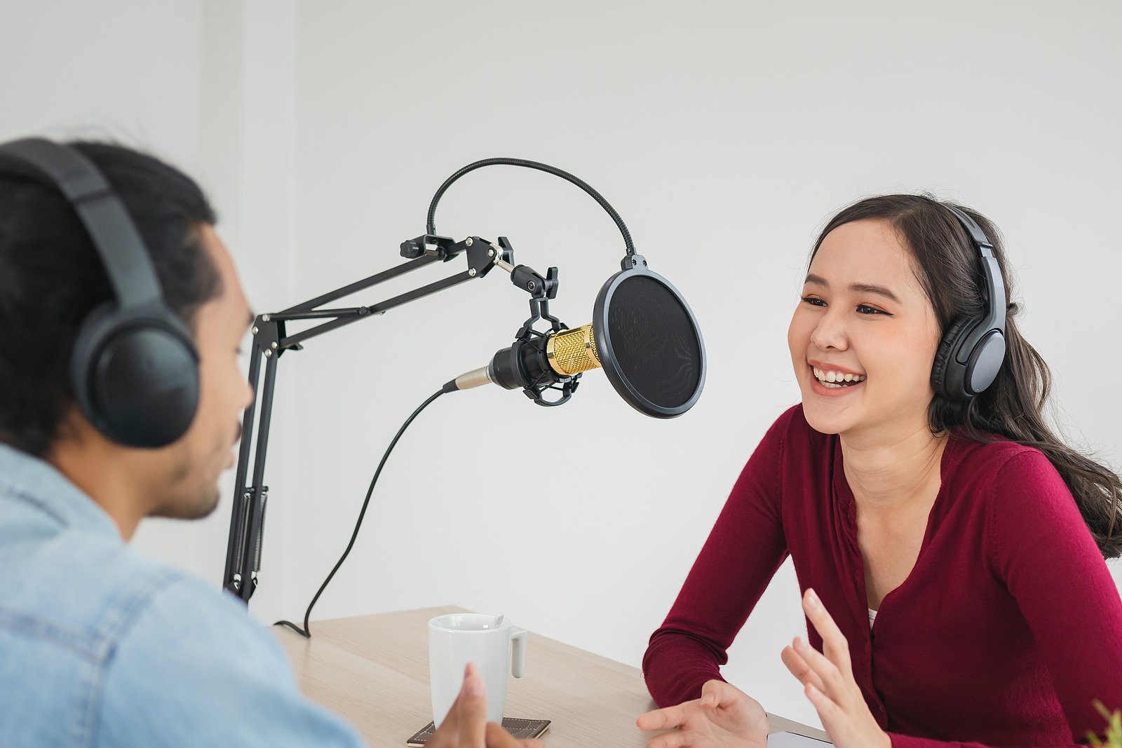 Las Vegas podcast studio showing woman and man talking